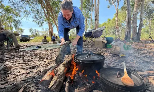 Michelle Franklin preparing fish caught at Mula Billabong.