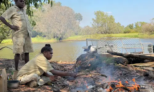 Djurrubu Rangers preparing a campfire lunch.