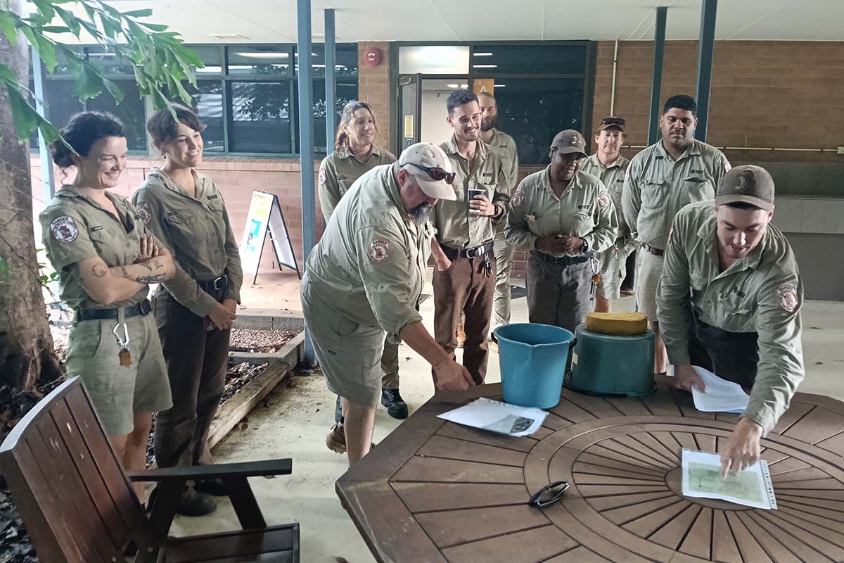 Ranger Toby uses props including a sponge and a bucket of water to demonstrate the porous qualities of Litchfield National Park’s escarpment country, as part of his training in preparation for the Territory Parks Alive program.